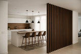 Decorative wood slat dividers are used to create subtle room segmentation, enhancing the overall design with rich natural wood tones.