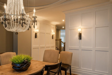 Shaker style MDF stiles used to create full-height wall paneling in a dining room with clean rectangular grids and smooth primed finishes.