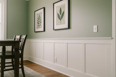 Elite Shaker Paneled Wainscoting Kit installed along a dining room wall, featuring primed shaker stiles, upper and lower rails, and a poplar cap trim in a clean white finish
