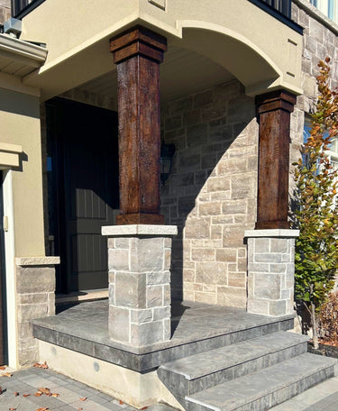 Outdoor space featuring faux barnwood column wraps made from durable polyurethane, offering a realistic reclaimed wood appearance with lightweight, easy-to-install design for rustic or modern architecture.