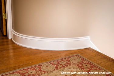 White flexible baseboard molding with optional flexible shoe trim for curved walls and hardwood floors.