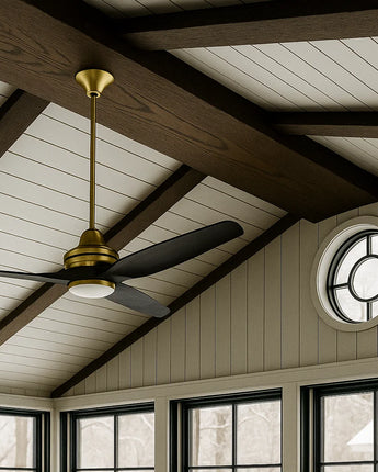 Custom-sized stained red oak ceiling beam in a room featuring a ceiling fan and a large oval window, adding warmth and architectural contrast to the space.